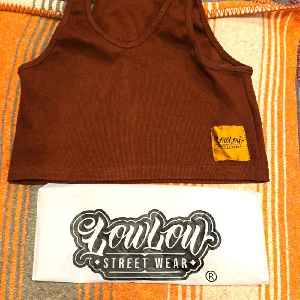 New in bag, crop tank. I have one brown and one pink.